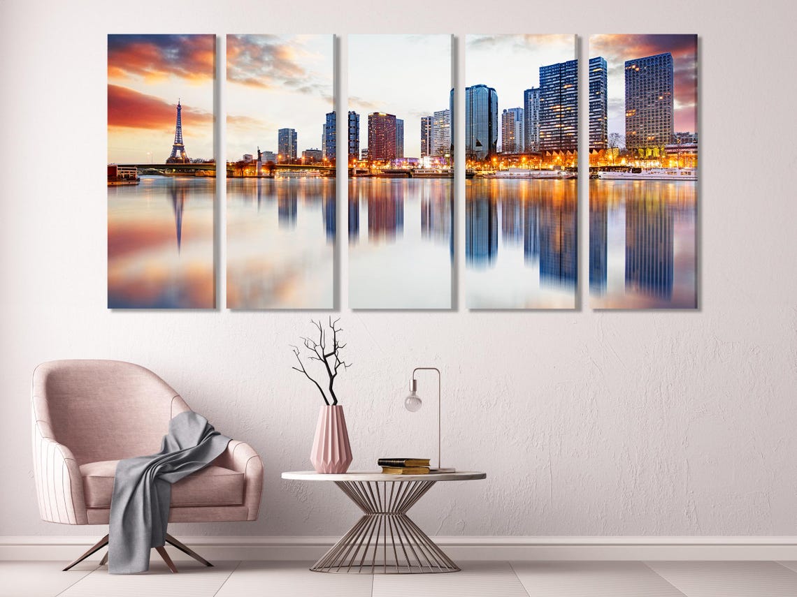 Room mockup showing three dusk city skyline panels above a dining table