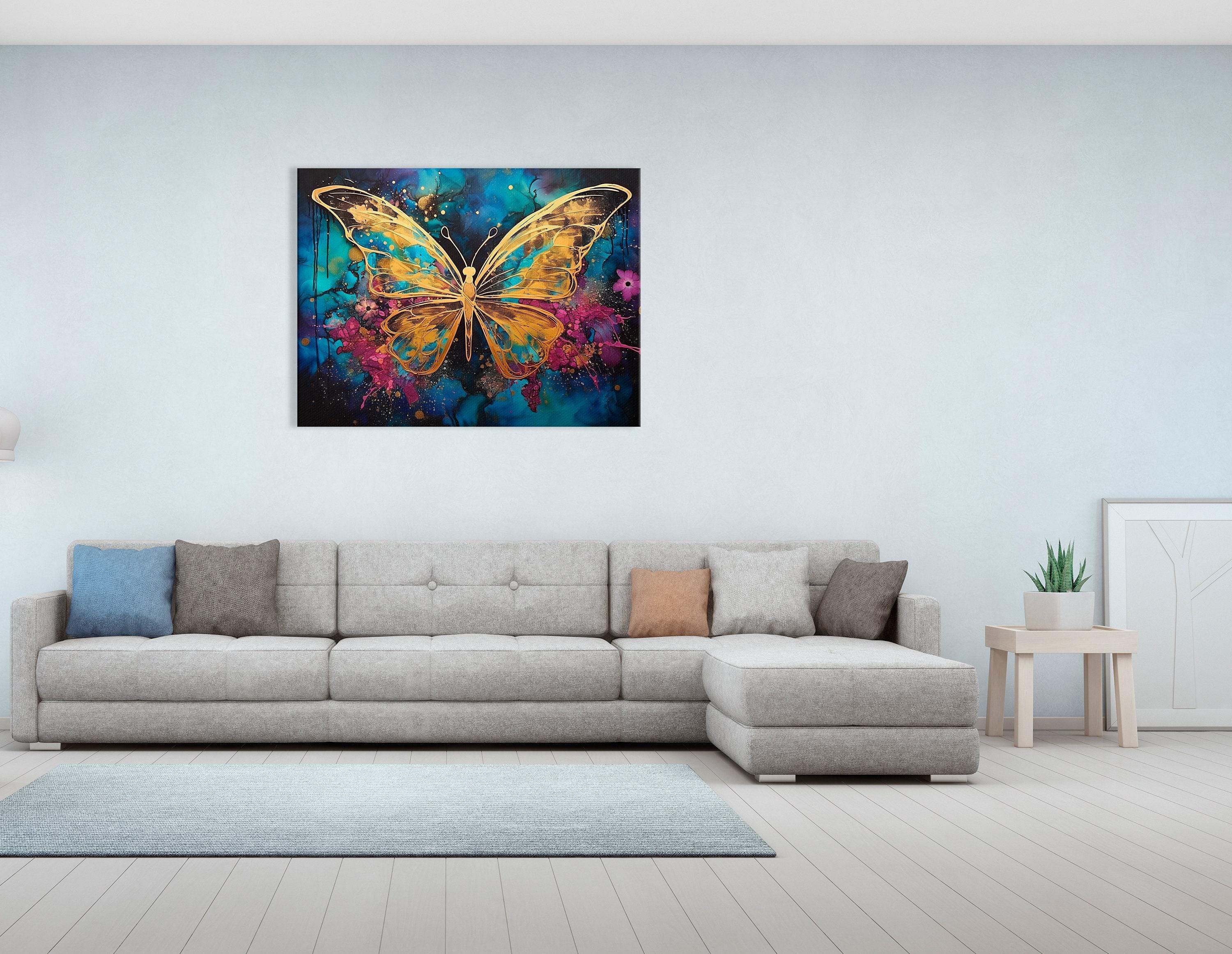 Abstract gold butterfly on a teal, blue and magenta splash background with glitter-like speckles detail view