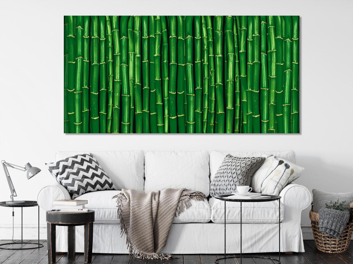 Room mockup showing a bamboo triptych artwork with green and gold accents above a sofa