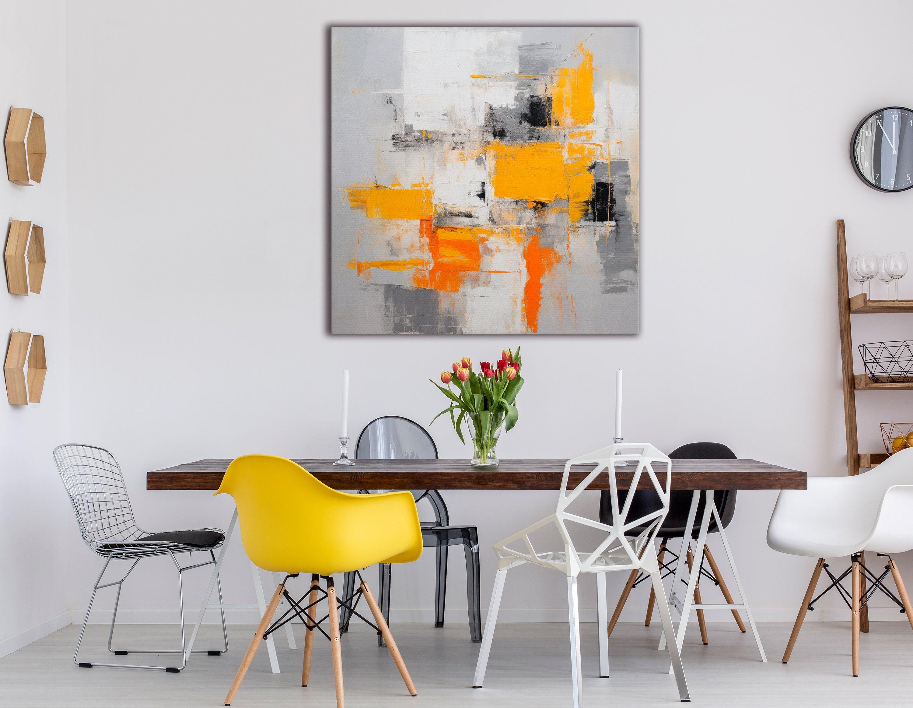 An abstract city-block style collage of white, grey and black shapes is overlaid with bright yellow and orange blocks, accented by scumbled