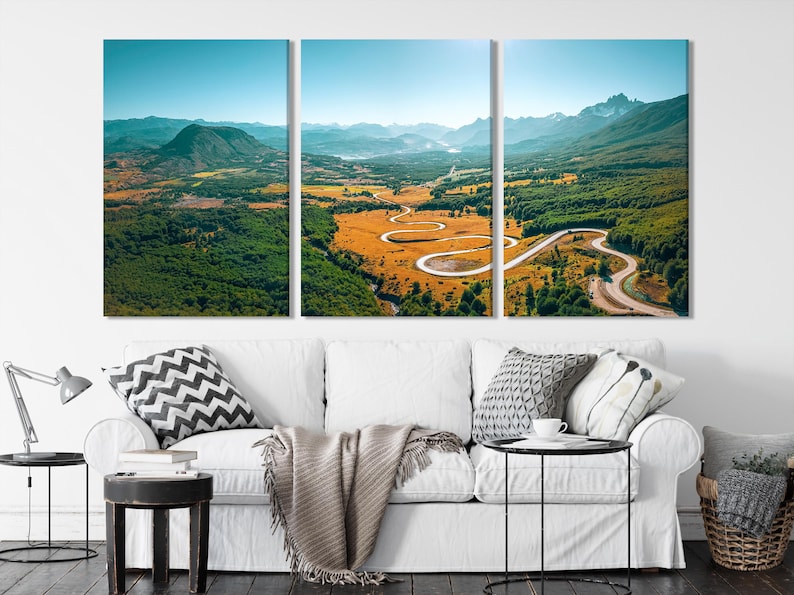 Three-panel mountain landscape with a winding road through green valleys and golden fields beneath a blue sky
