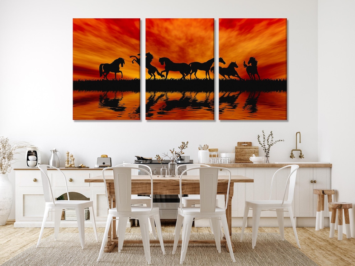 Room mockup showing a large horses sunset silhouette artwork above a bed and sofa area