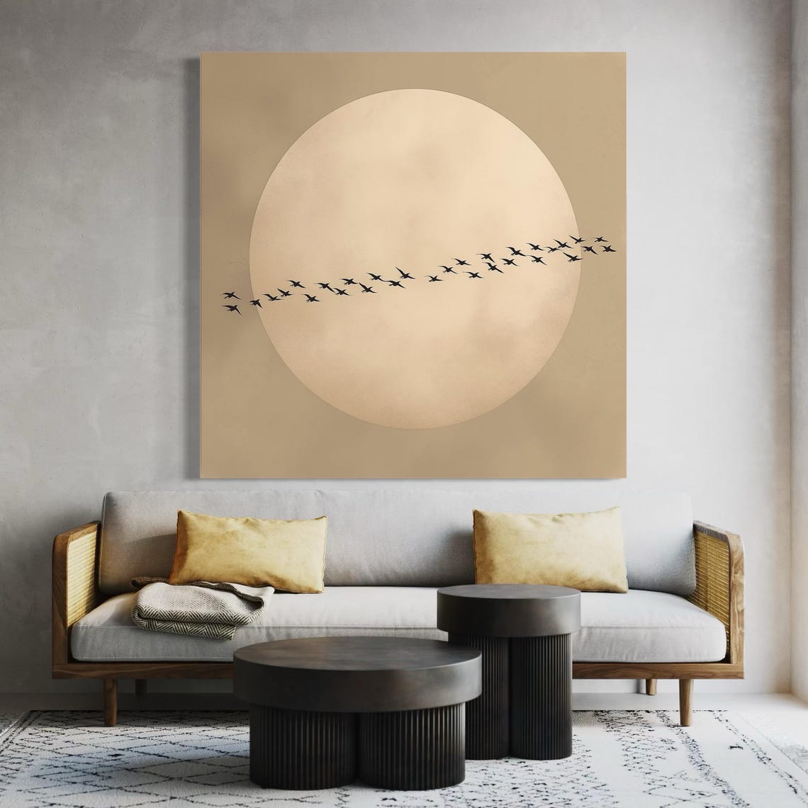 A living room mockup with a wall hanging showing a pale moon and flying bird silhouettes