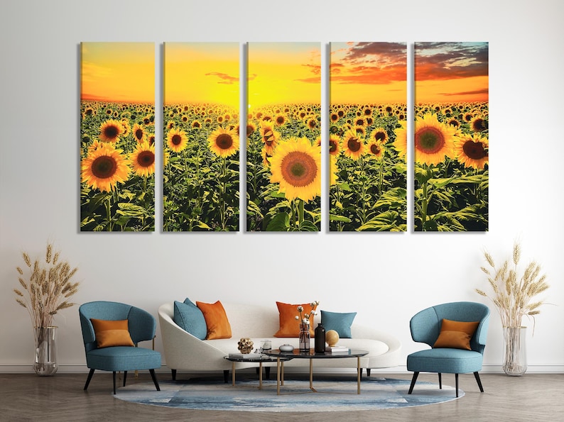 Sunflower field at sunset with bright yellow flowers and warm orange clouds