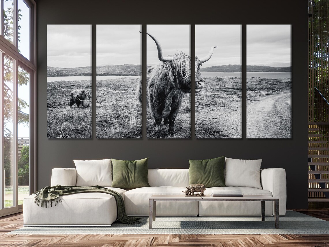 Room mockup showing a black and white Highland cow artwork above a sofa