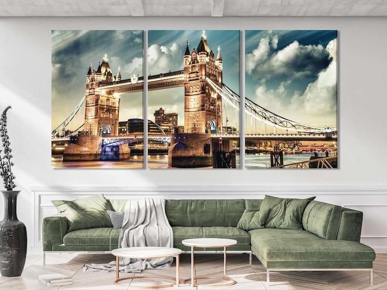 Three-panel night cityscape showing Tower Bridge with illuminated towers and cloudy blue-grey sky
