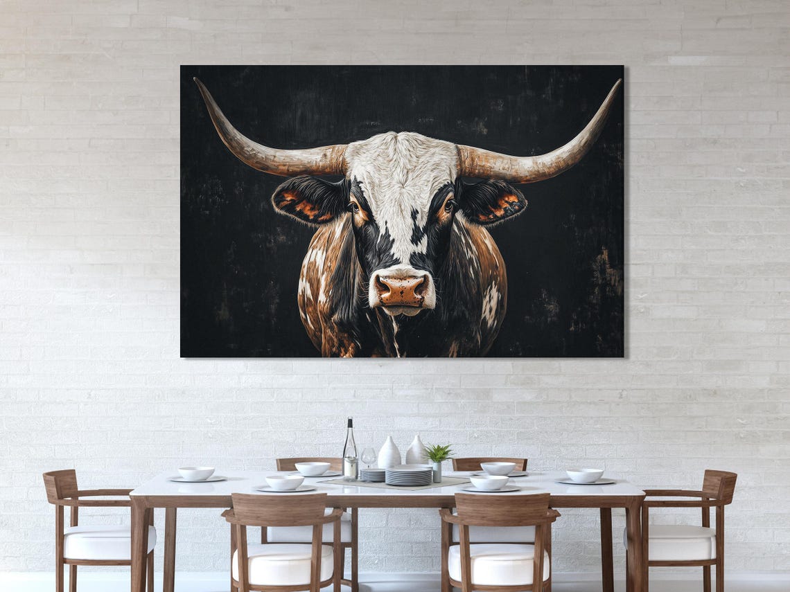 A three-panel artwork shows a longhorn-style cow portrait with sweeping horns against a dark, textured background, in high-contrast black, cream and
