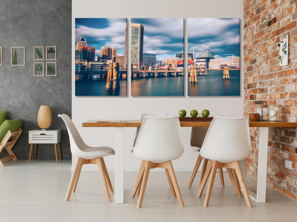 Room mockup showing a waterfront cityscape artwork above a sofa