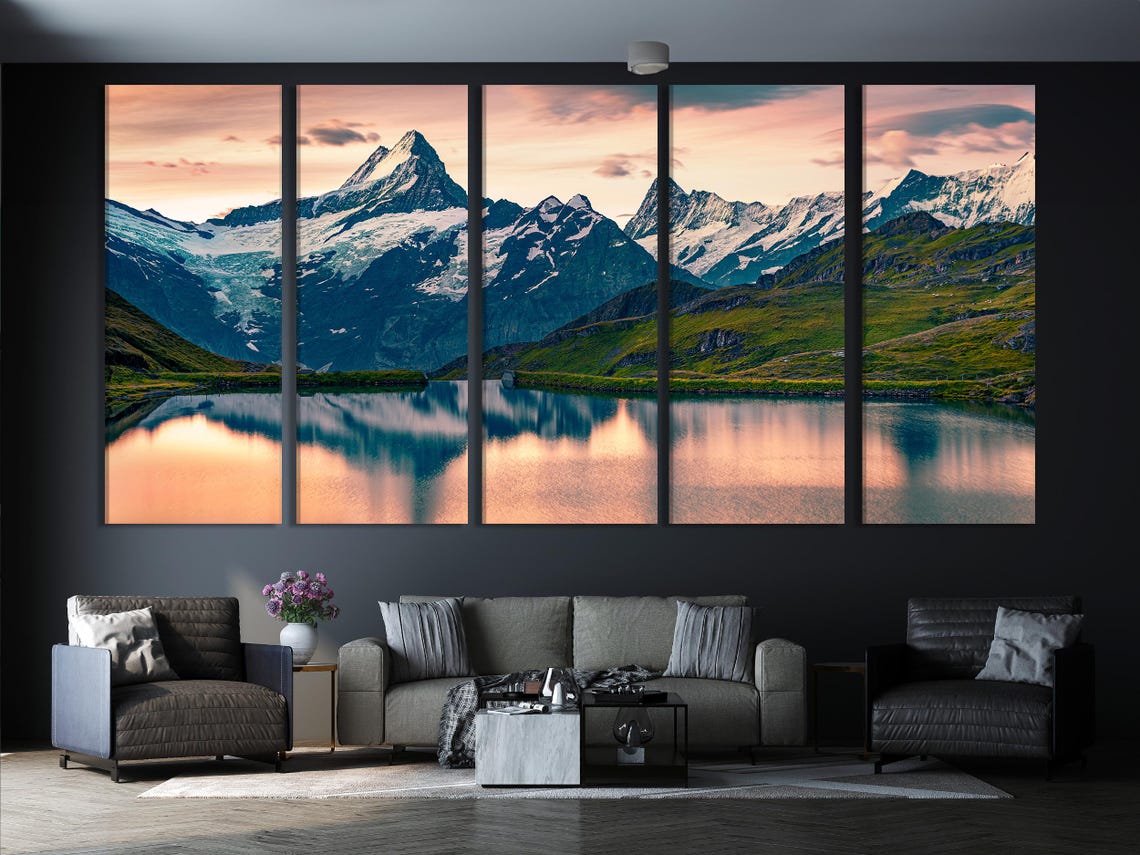Mountain lake landscape with snowy peaks and sunrise sky in blue and blush pink detail view