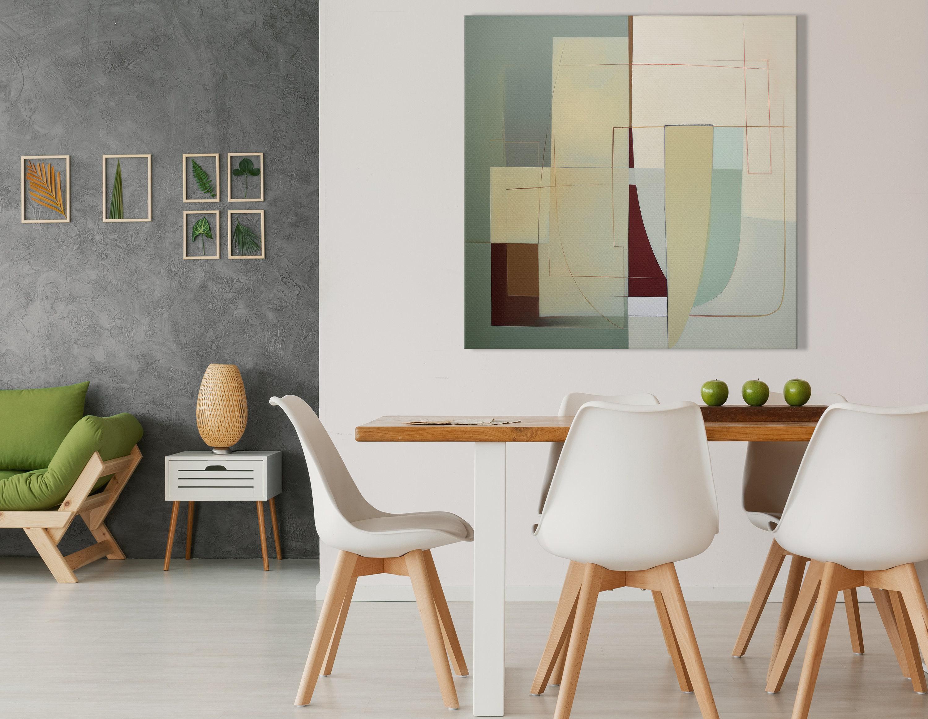 A framed abstract geometric composition combines muted sage and terracotta blocks with cream and burgundy lines in a balanced, mid-century style