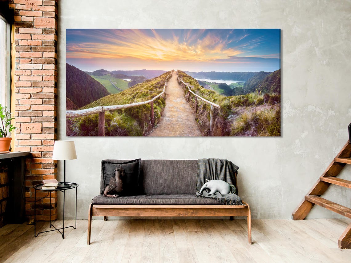 Room mockup with sofa and multi-panel landscape artwork above it