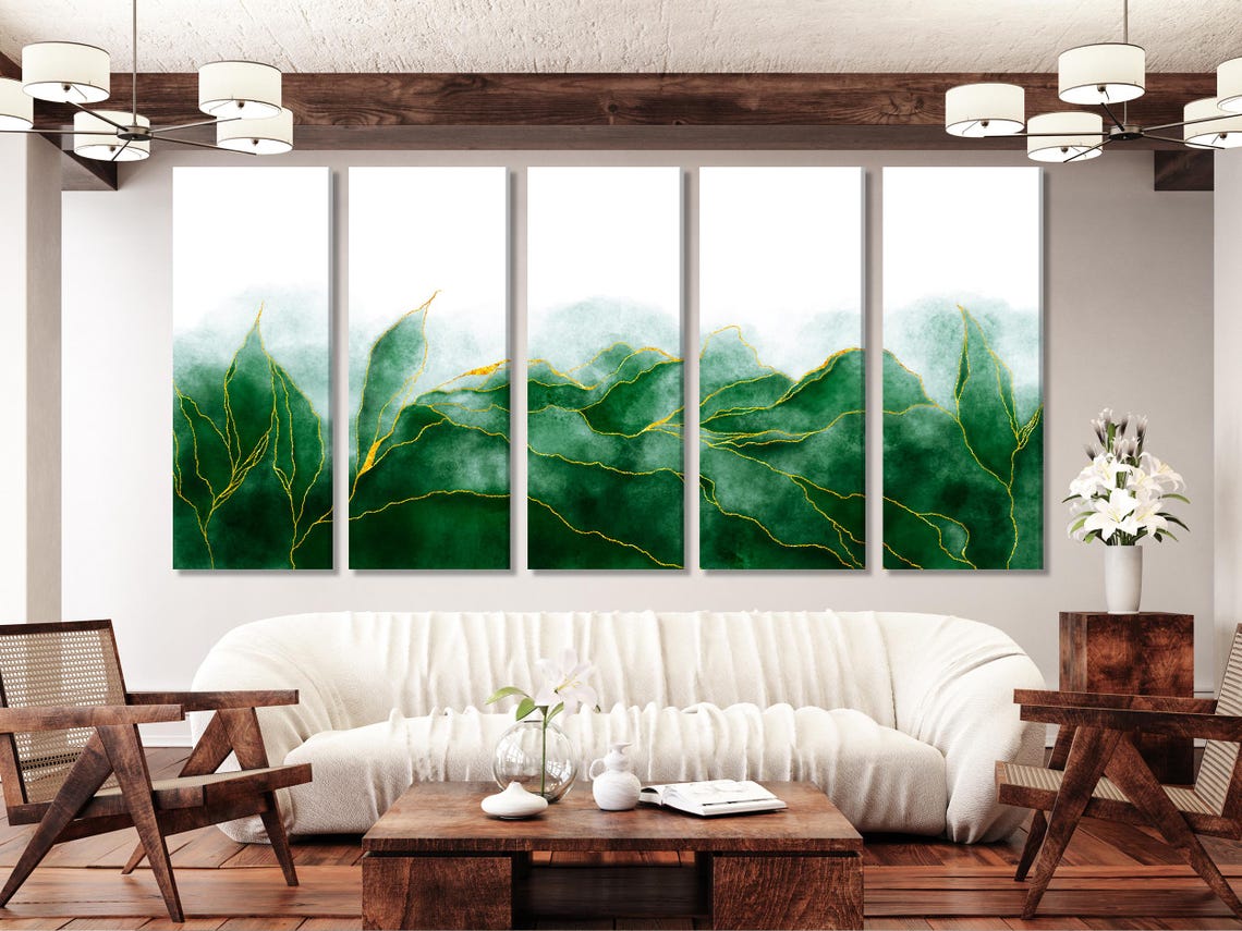 Abstract botanical artwork triptych above a sofa in a bright room