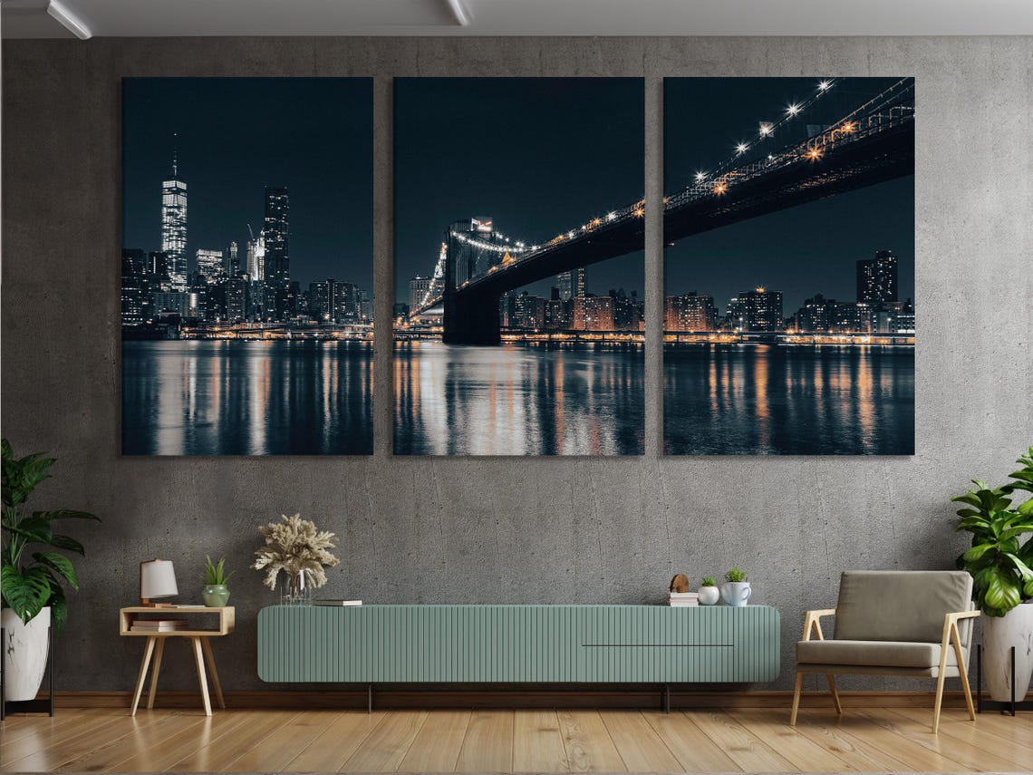 Room mockup showing a night cityscape bridge artwork above a sofa