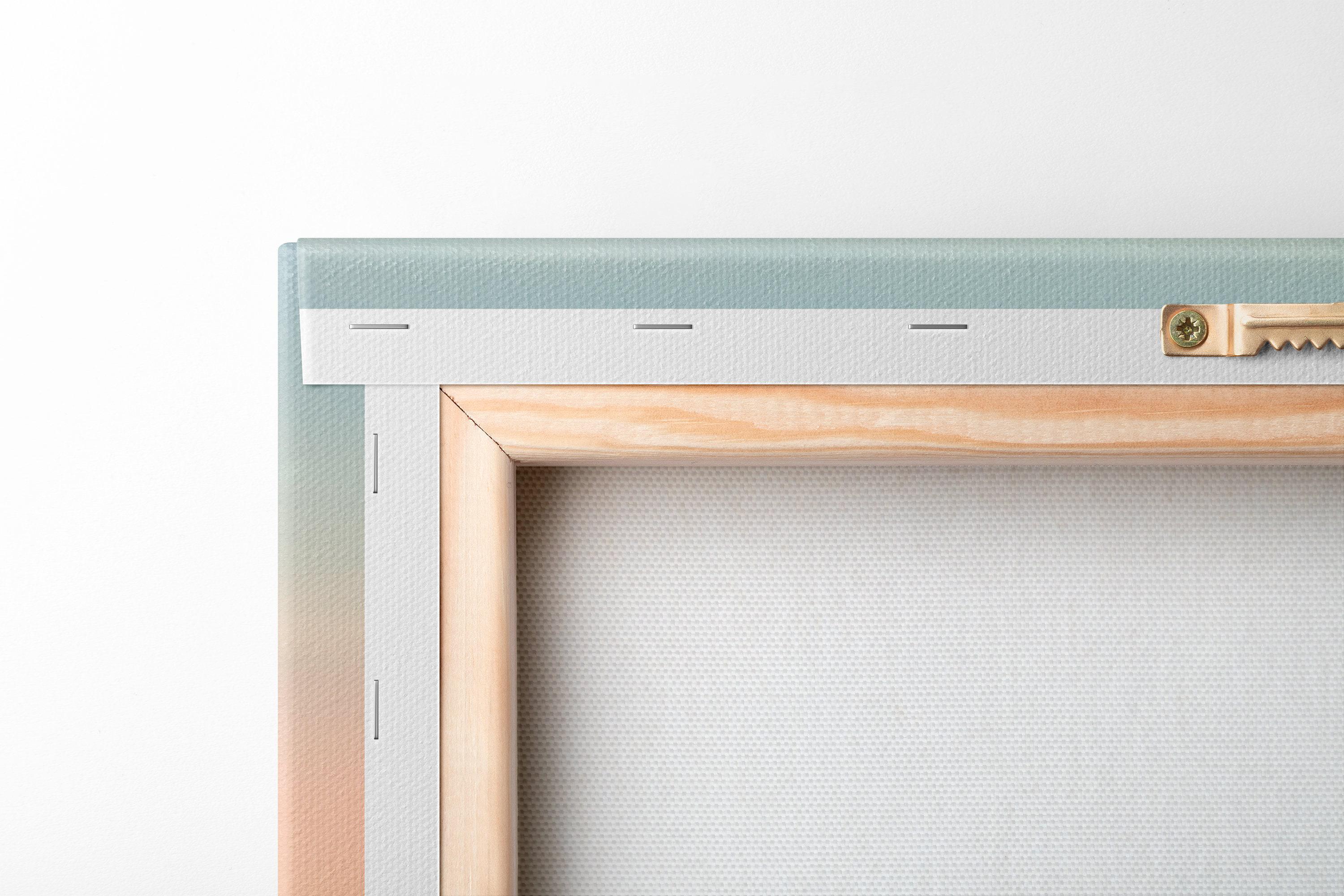 Bedroom scene with a framed pastel sailboat seascape above a bed