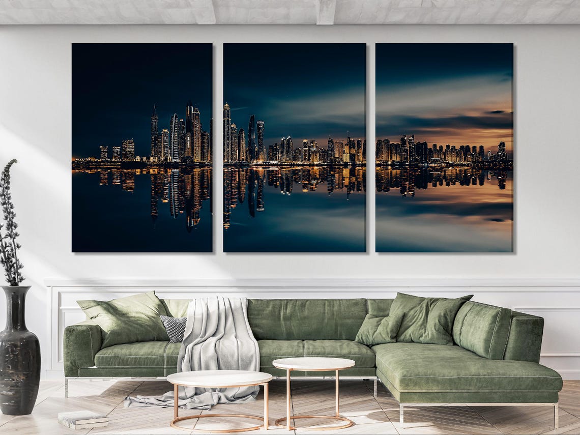 Five-panel night city skyline with illuminated skyscrapers and reflected lights on water detail view
