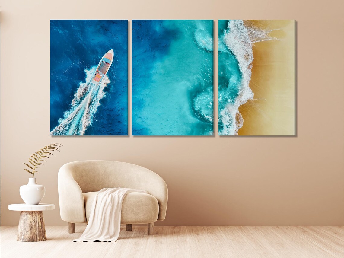 Aerial ocean scene shows a white fast boat cutting through bright turquoise water, with foamy waves and a sandy shoreline on the right detail view