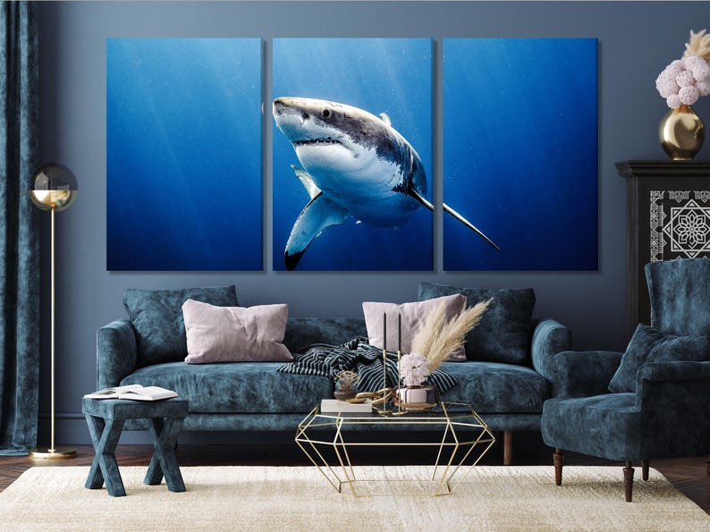 Realistic great white shark swimming through deep blue underwater water