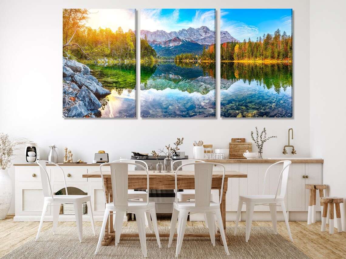 Room mockup showing a bedroom with a panoramic mountain lake landscape artwork above the bed