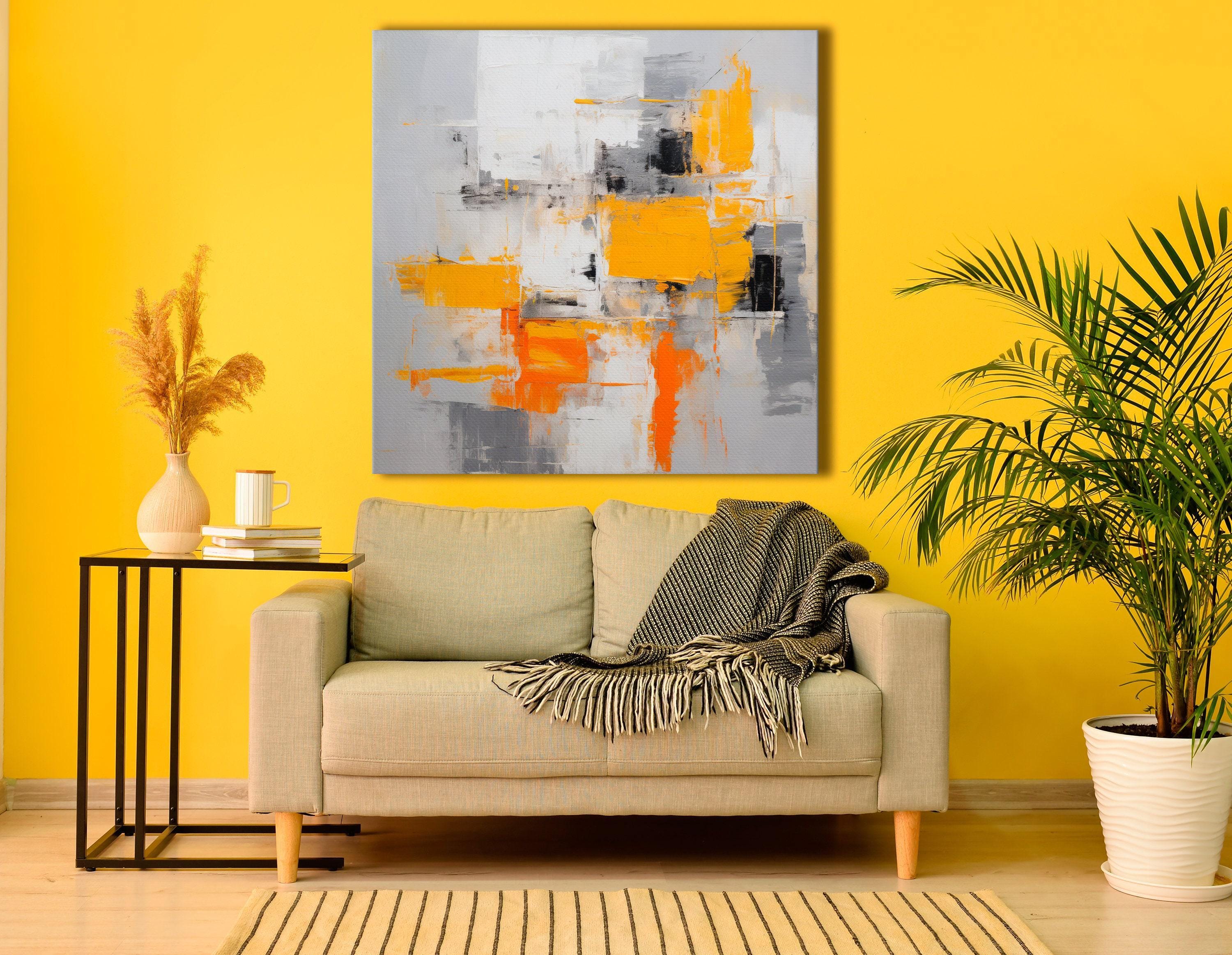 An abstract city-block style collage of white, grey and black shapes is overlaid with bright yellow and orange blocks, accented by scumbled