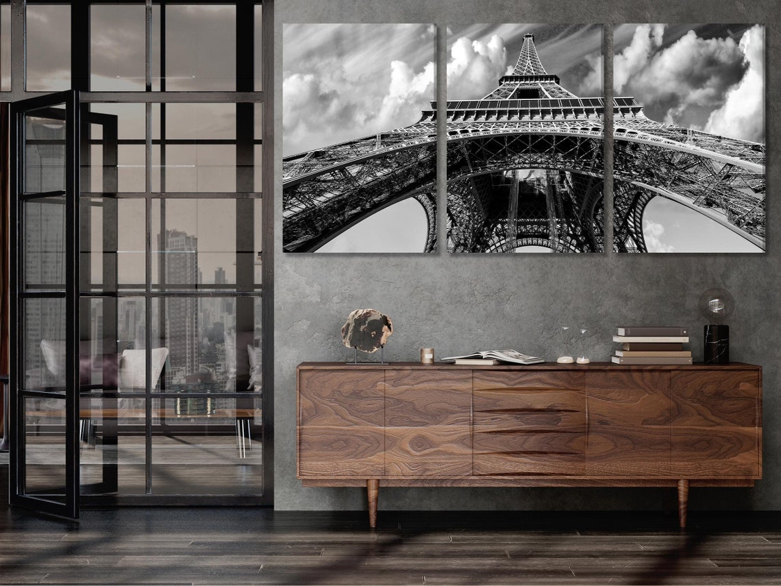 Room mockup with a large black-and-white Eiffel Tower artwork above a sofa