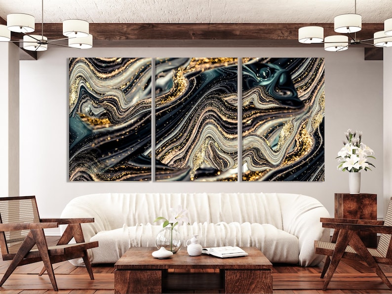 Three-panel abstract marble swirls in black, teal and grey with gold flecks and streaks