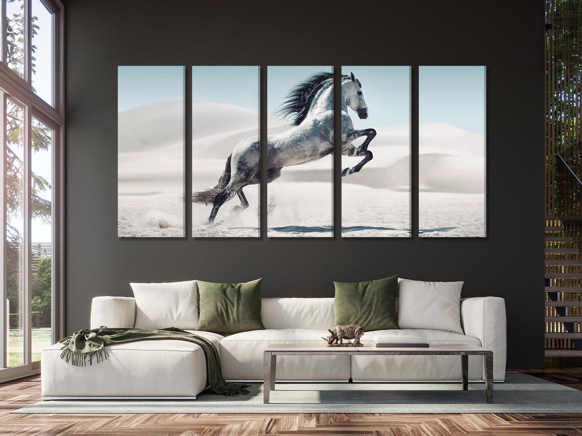 A galloping white horse mid-leap surges across pale sand dunes, with soft blue sky and hazy desert hills rendered in a photoreal style detail view