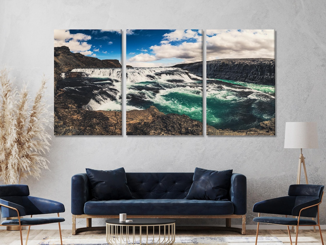 Room mockup with a row of five waterfall landscape artworks above a green sofa