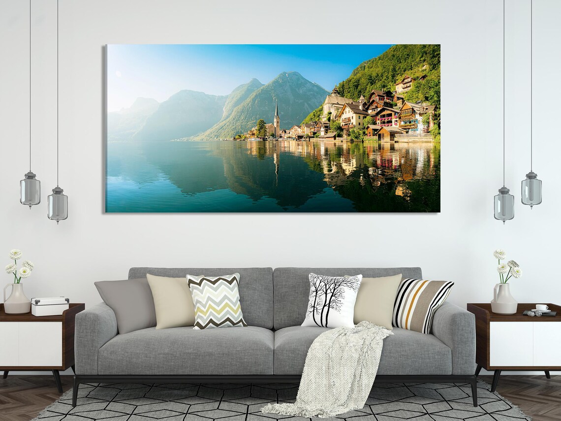 Three-panel mountain lake landscape with teal water reflections, alpine green hills and a lakeside village with a church spire detail view