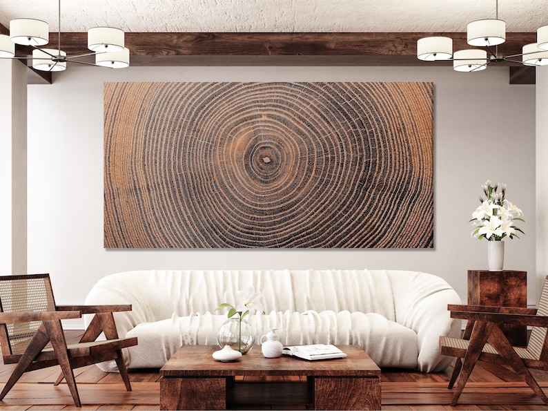 Concentric tree ring pattern in warm beige and charcoal with a small central circle