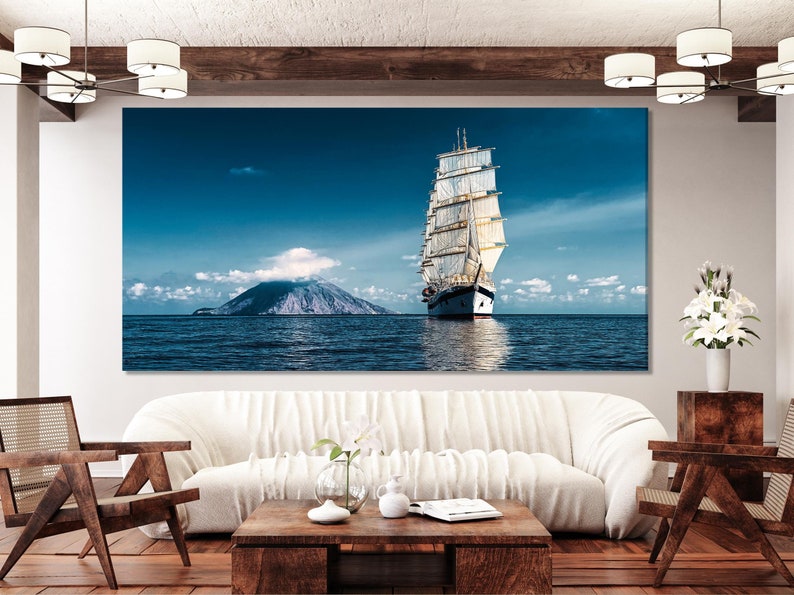 Realistic sailing ship on calm blue ocean water under a clouded sky