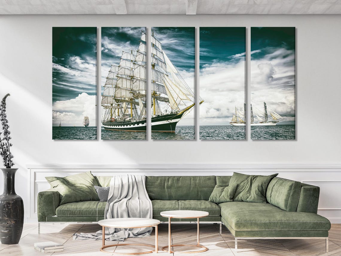 Sailing ship artwork on a wall above a dining table