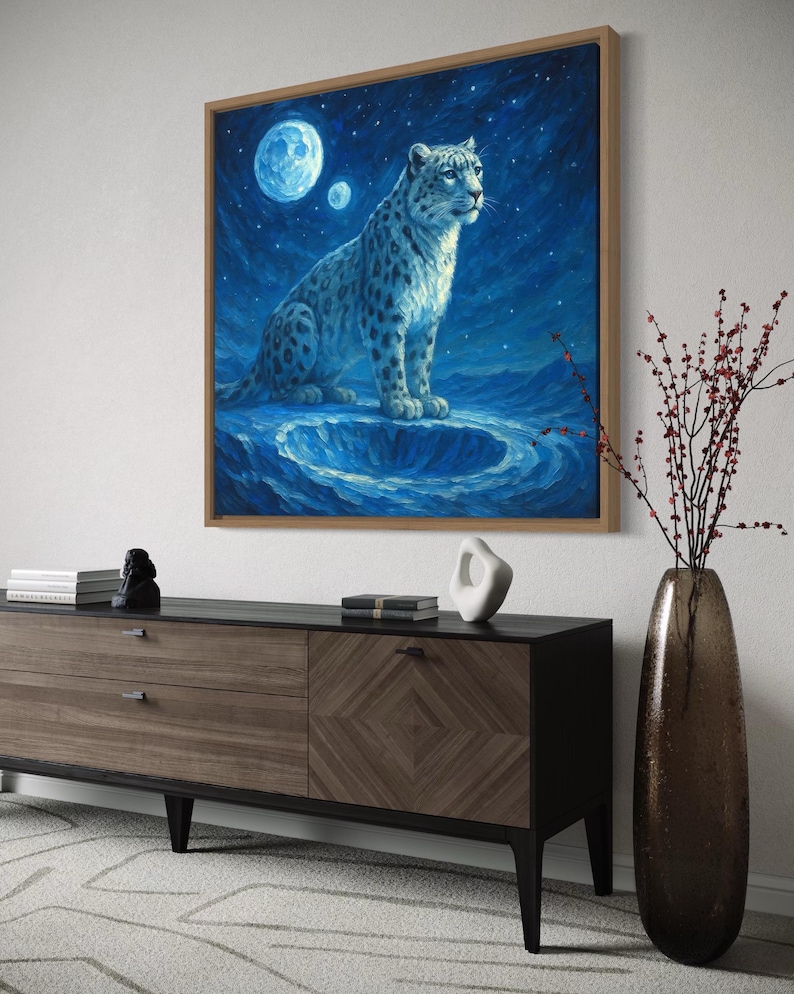 A snow leopard sits on a blue ledge beneath a glowing moon and starry night sky