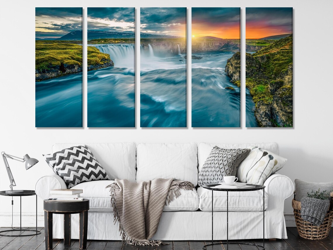 Three-panel waterfall landscape with rocky cliffs, green hills and sunset glow in cool teal and blue detail view