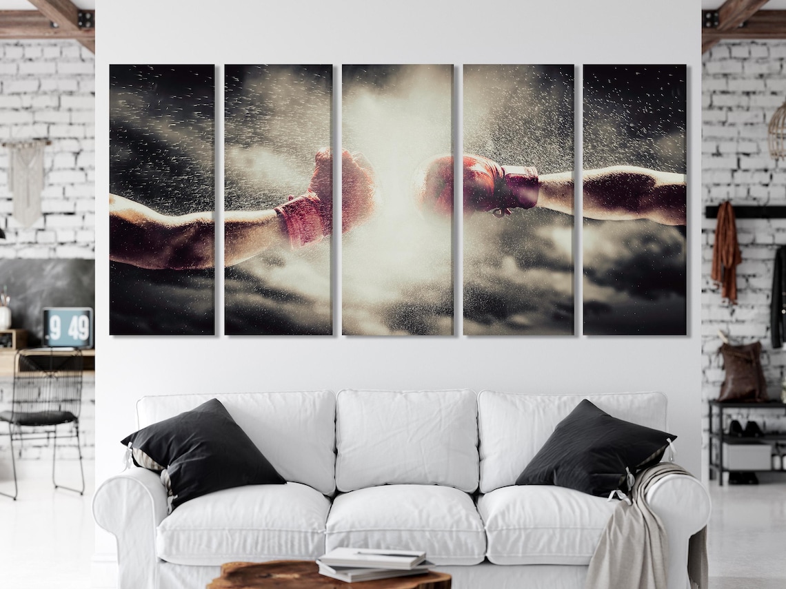 Boxing gloves artwork displayed above a dining table in a bright room