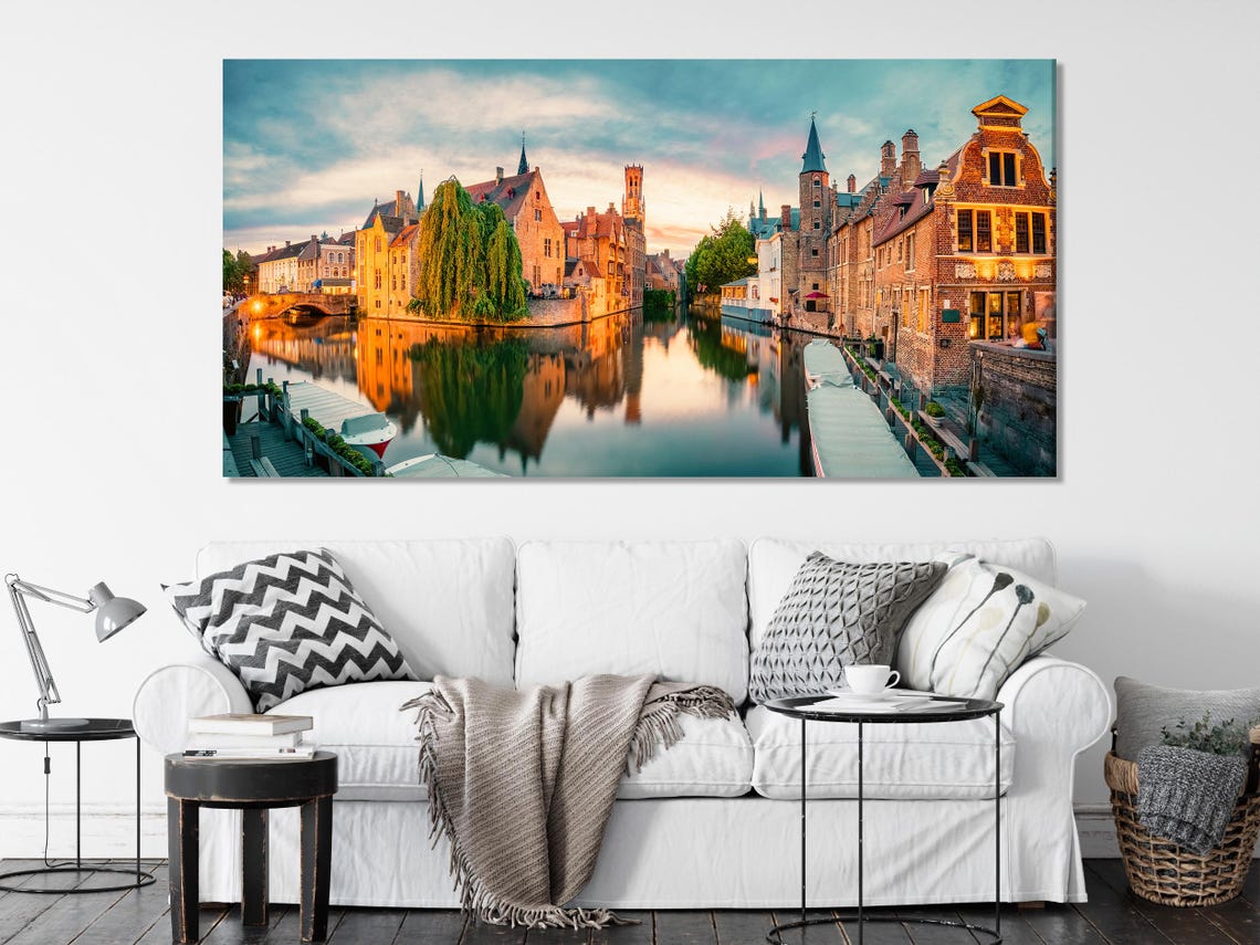 Living room mockup wall with split vertical canal cityscape artwork above a sofa