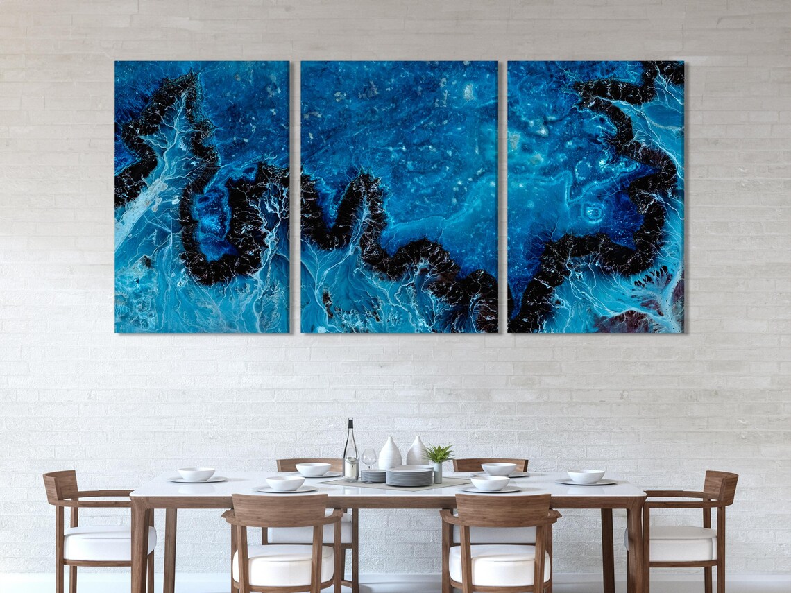 Room mockup showing a deep blue abstract artwork above a sofa