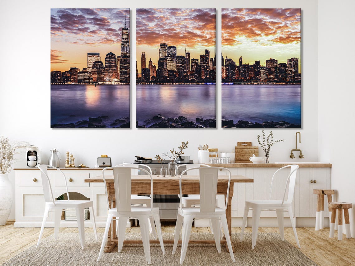 Room mockup featuring a sunset city skyline artwork above a sofa