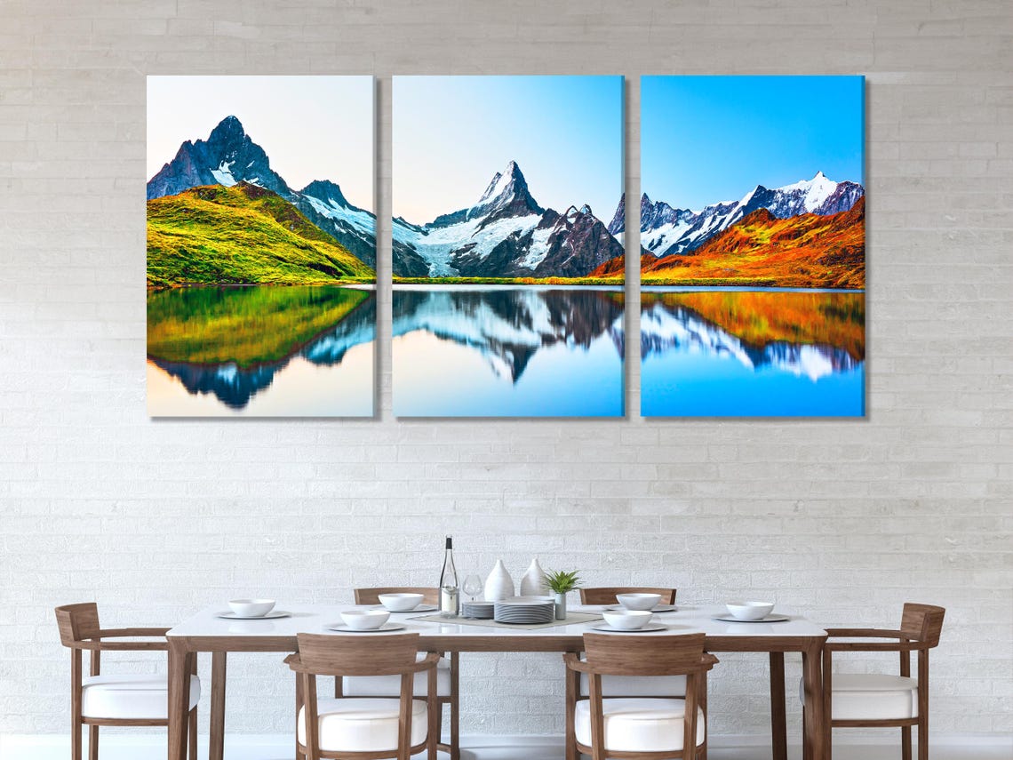 Living room mockup with multiple vertical panels showing a mountain sunrise landscape above a sofa