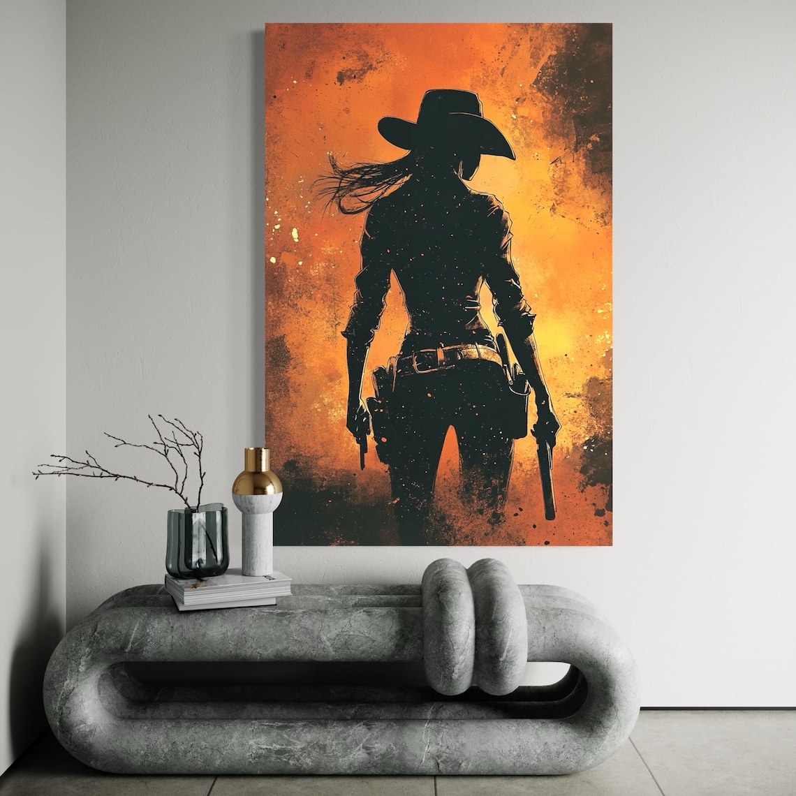 A dark, silhouetted western cowgirl stands with a horse, set against a fiery orange-to-yellow textured backdrop with scattered speckling detail view