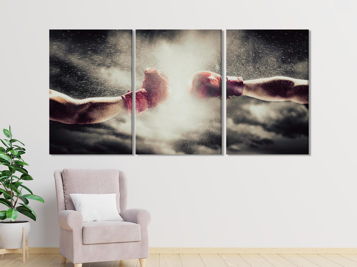 Boxing gloves artwork displayed above a dining table in a bright room