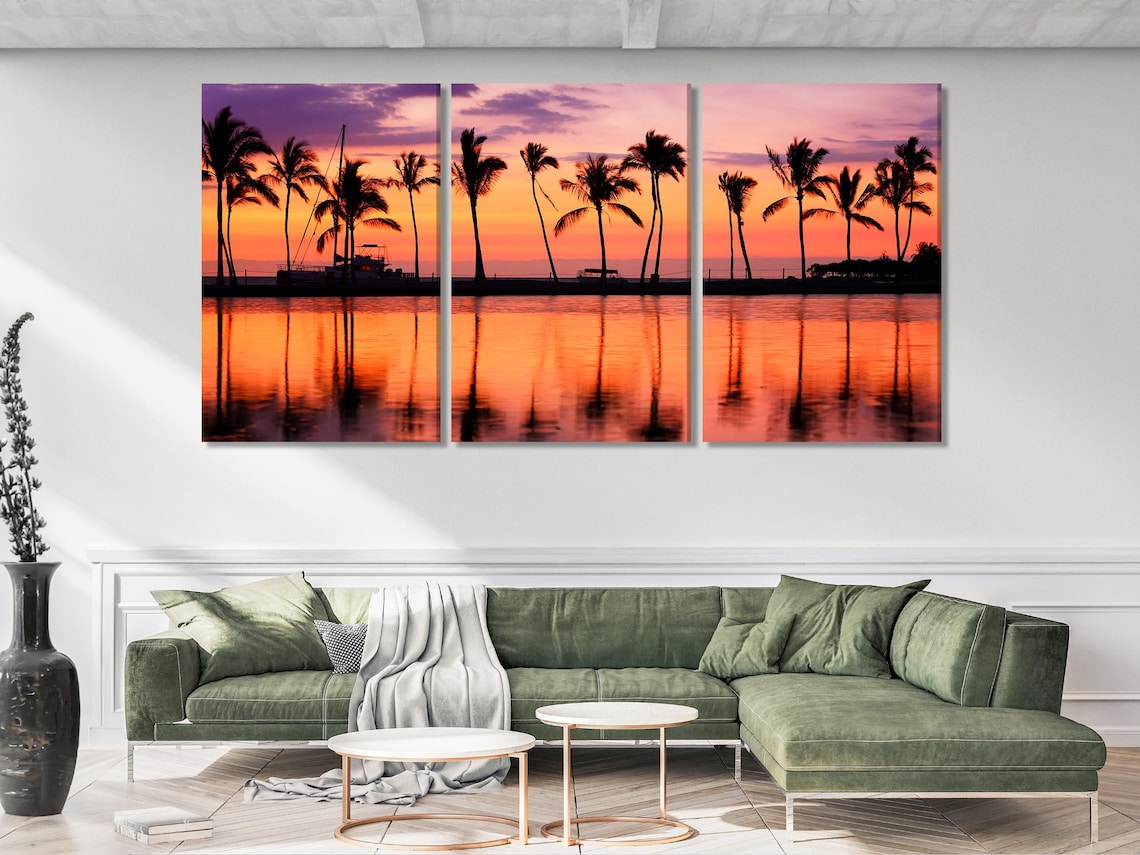 Room mockup with a framed sunset palm tree artwork above a dining table