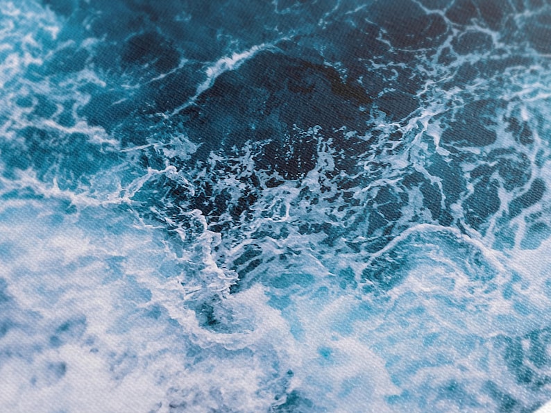 Close-up detail of turquoise ocean waves showing intricate foam patterns and textured canvas, creating a dynamic sea-inspired artwork.
