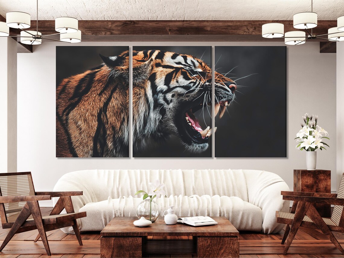 A roaring tiger portrait with orange-brown fur, black stripes and white facial markings on a dark background detail view