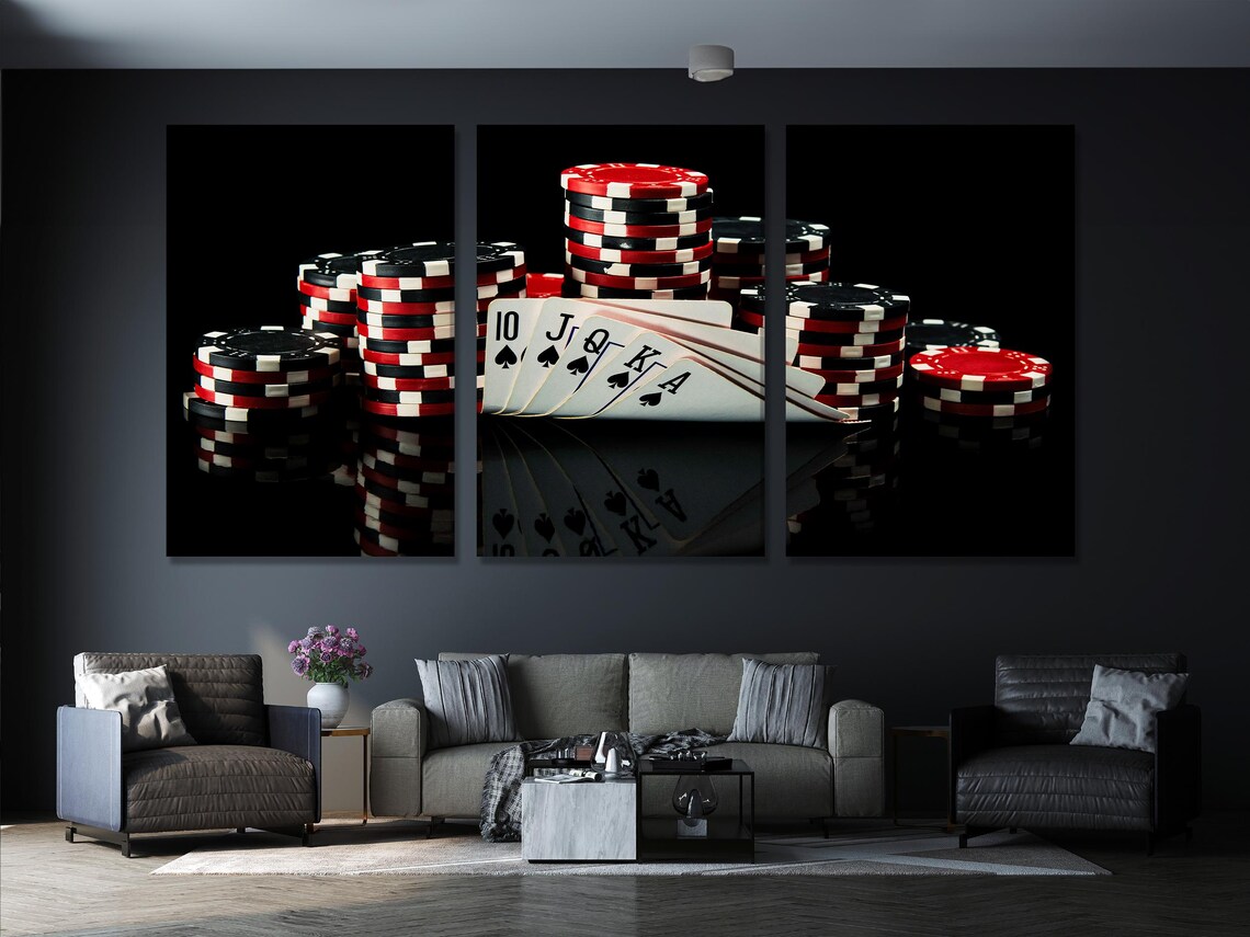 Poker cards and stacked red-and-white chips on a dark reflective casino background detail view