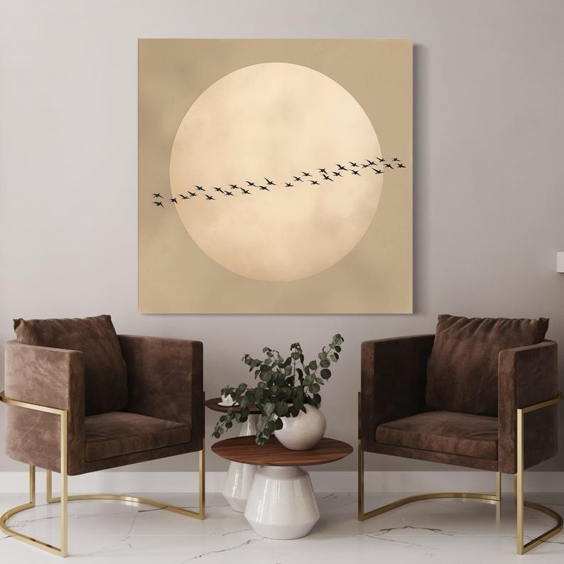 A pale moon with a flock of dark birds flying in an arc on a warm beige background