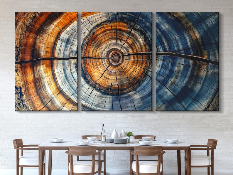 Three-panel abstract tree ring design with blue, teal and burnt orange concentric circles