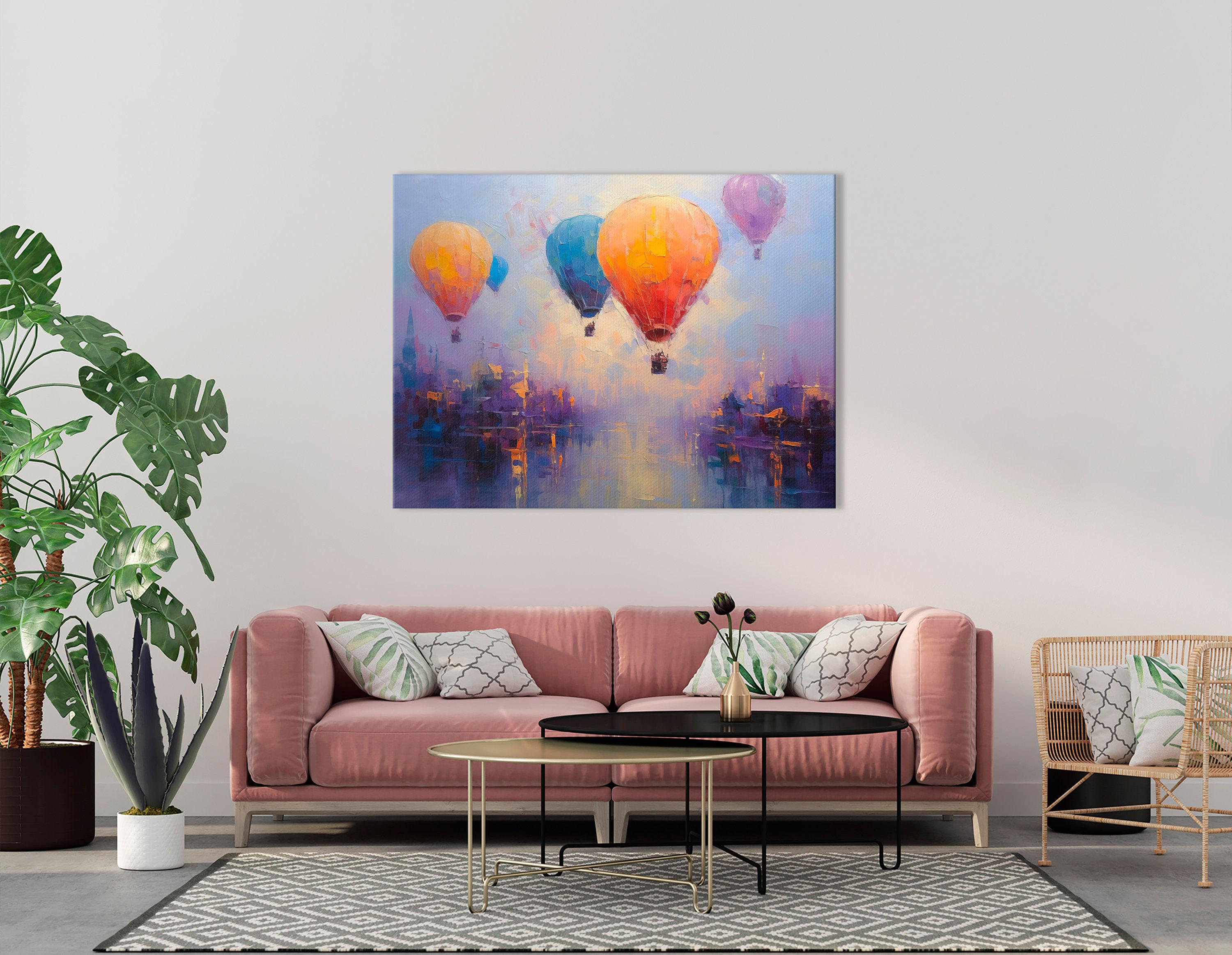Three colourful hot air balloons floating above a stylised city at sunset detail view