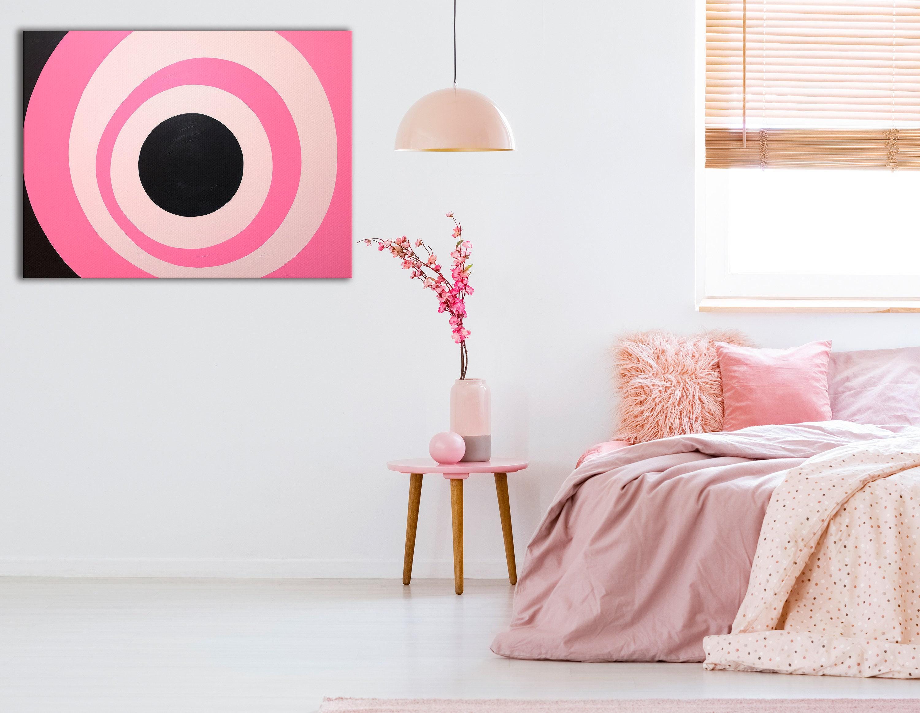 Hot pink and black concentric circles geometric artwork with pale ivory rings detail view