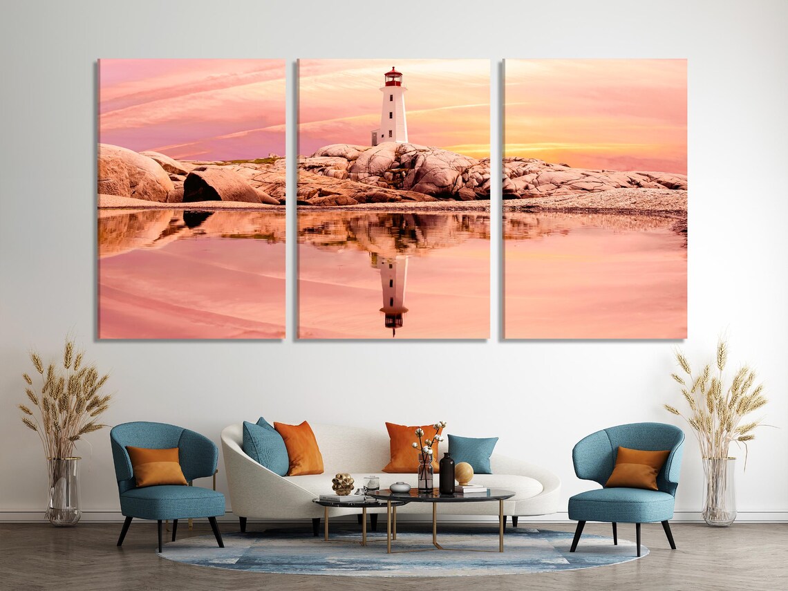 Room mockup with green sofa and a wall display of sunset seascape panels featuring a lighthouse