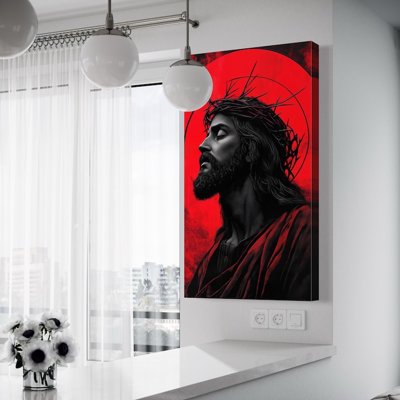 Stylised Jesus profile portrait in black on a vivid red background with a crown of thorns graphic above
